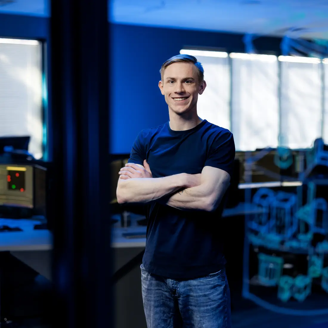 Jay Berry stand in the middle of a computer lab