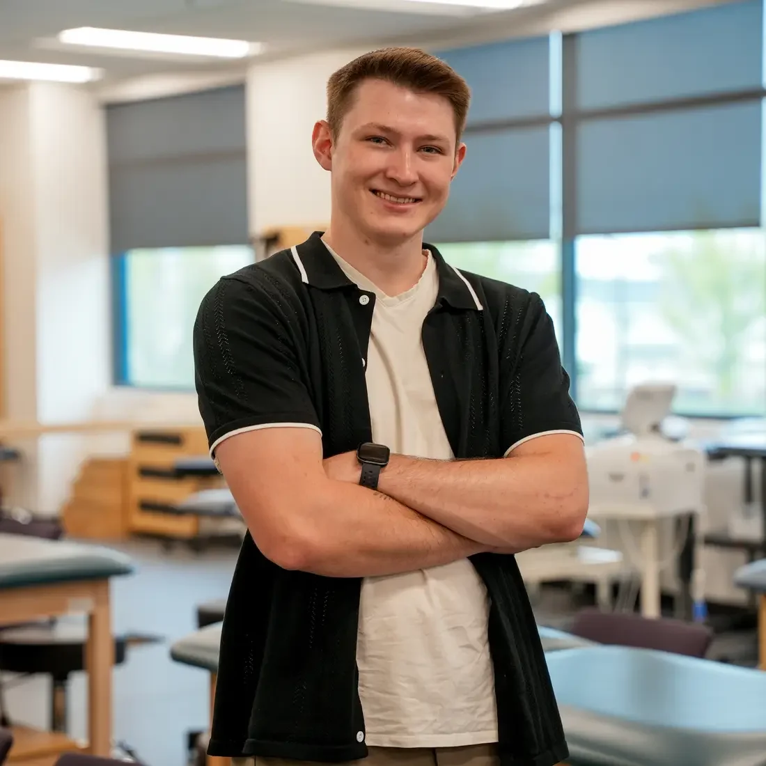 Austin Davis standing in Physical Therapy Assistant lab
