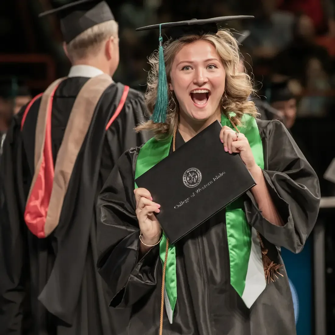 Person holding their diploma