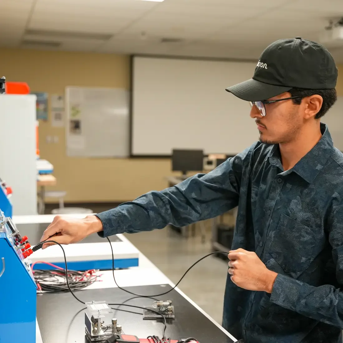Student plugging in cords