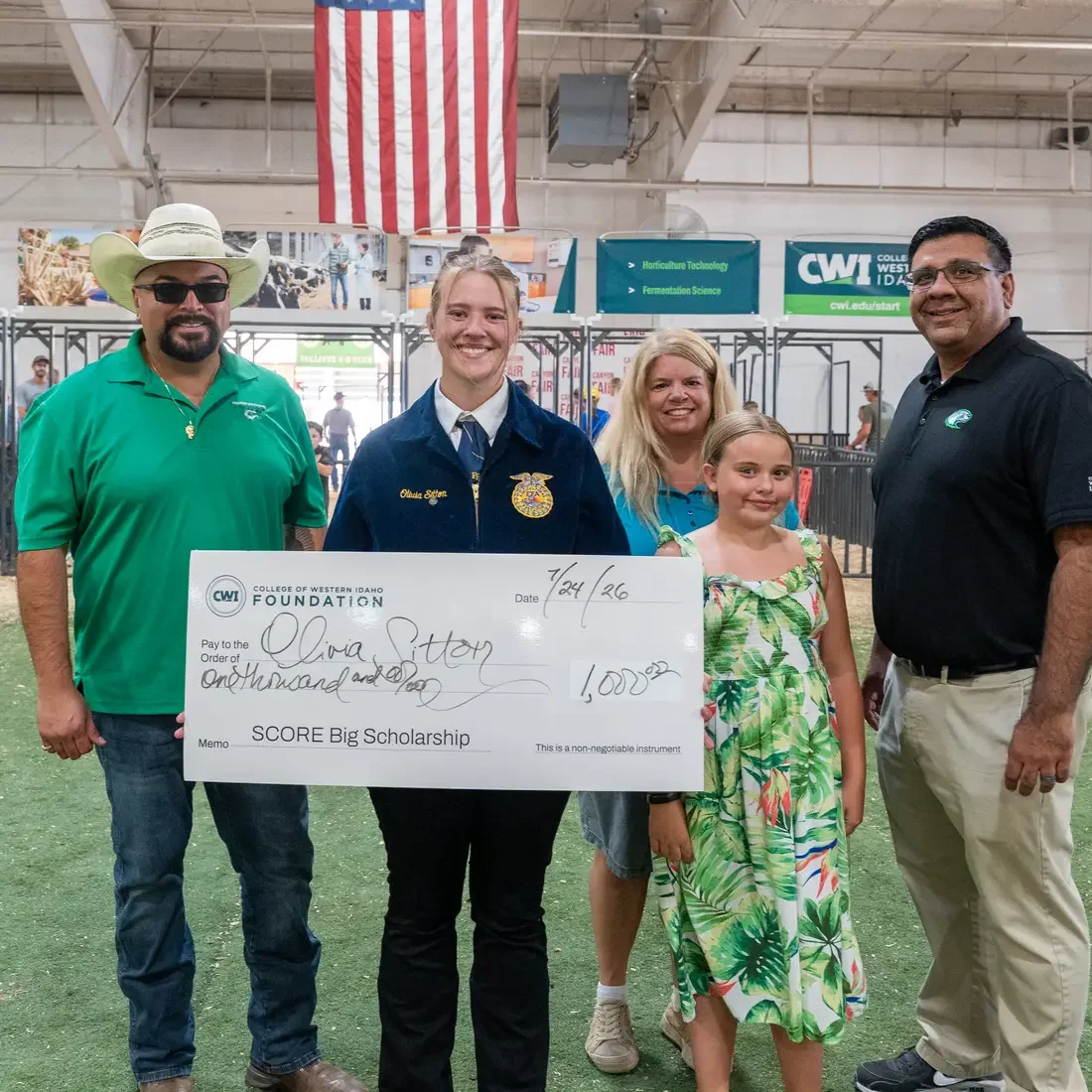 Olivia Sitton Holding Scholarship Check