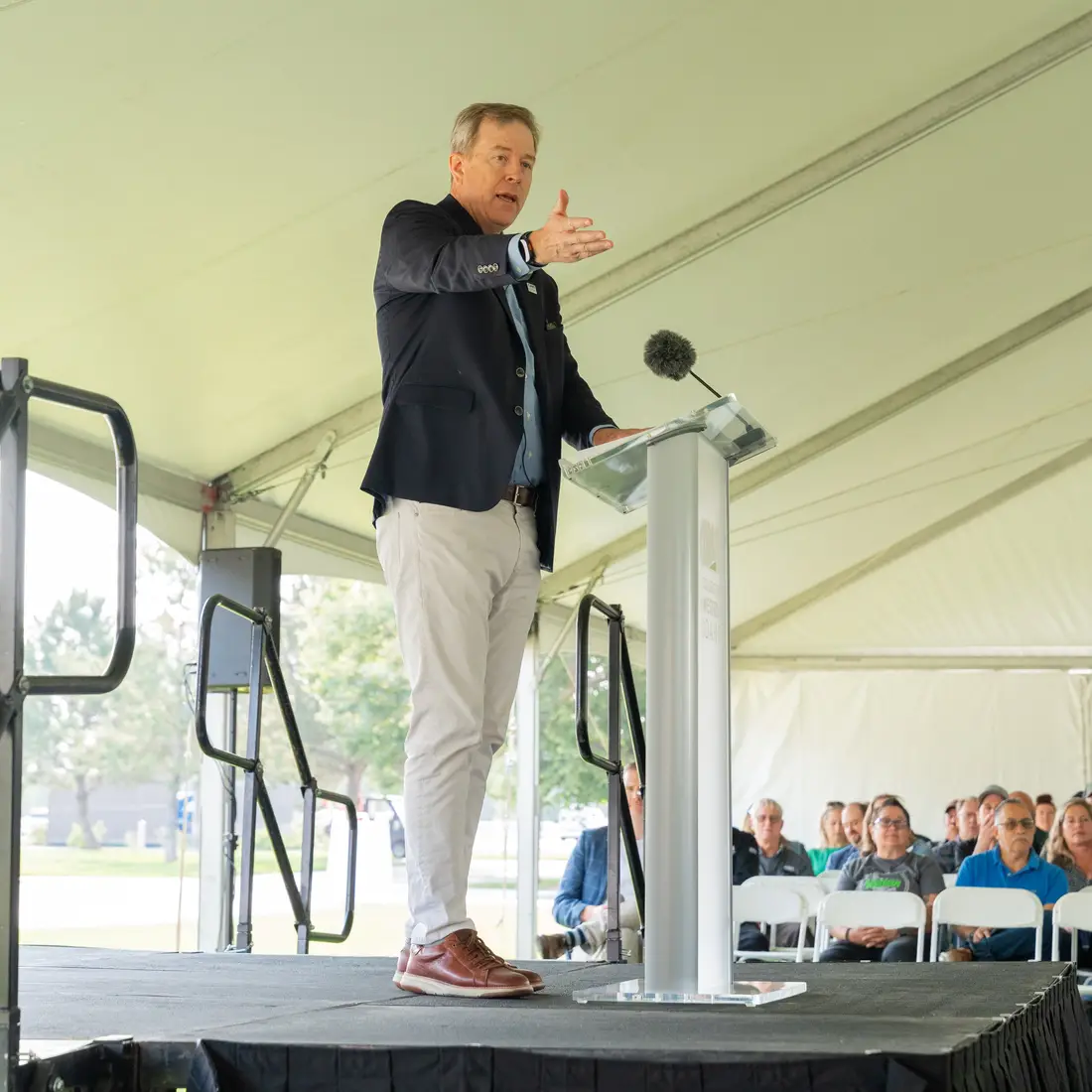 President Gordon Jones speaking behind podium