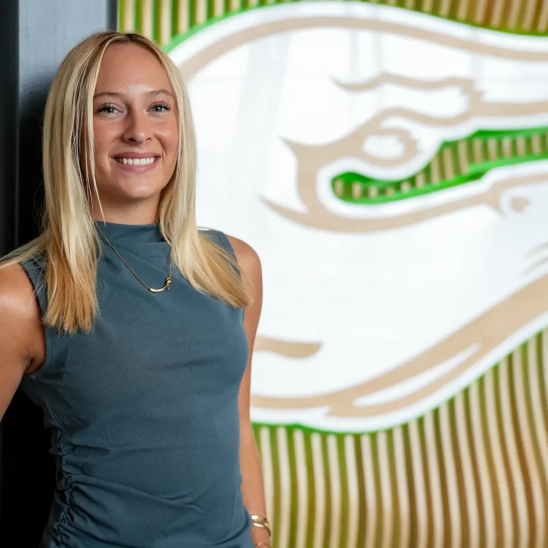 Brooke Garman standing near Otter wall