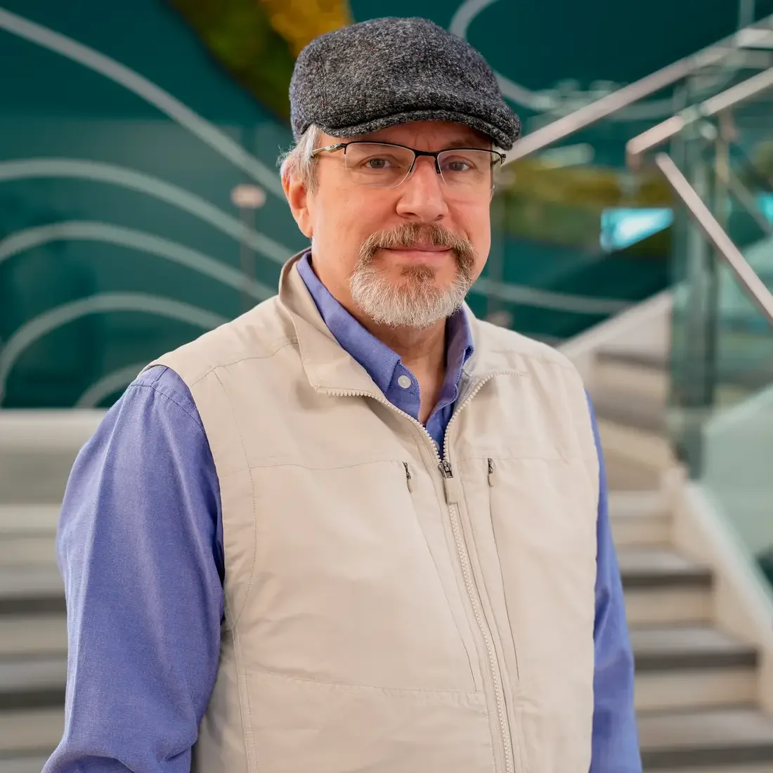 Andy Jensen stands in front of staircase