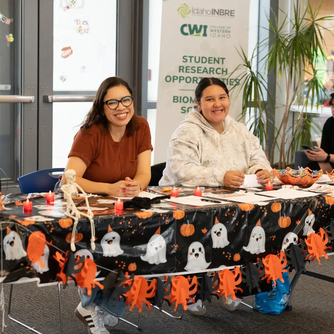 People at a table, smiling