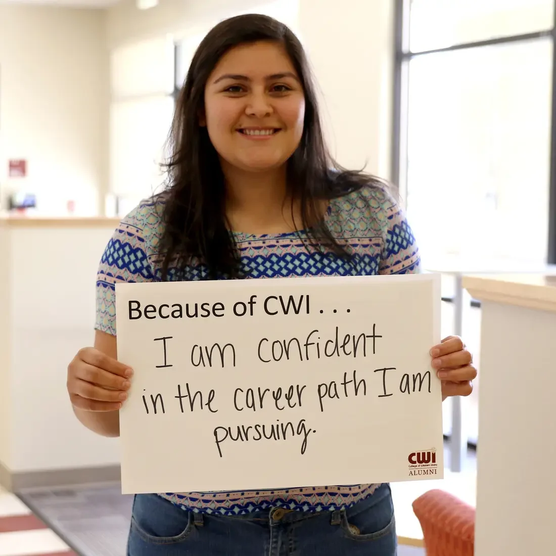 CWI Student with Because of CWI sign "I am confident in the career path I am pursing".