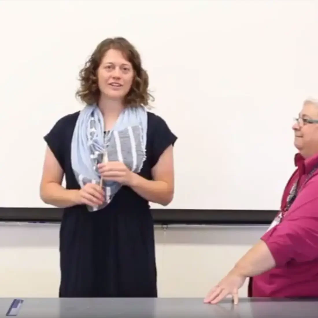 Molly Wolk resenting in front of a class