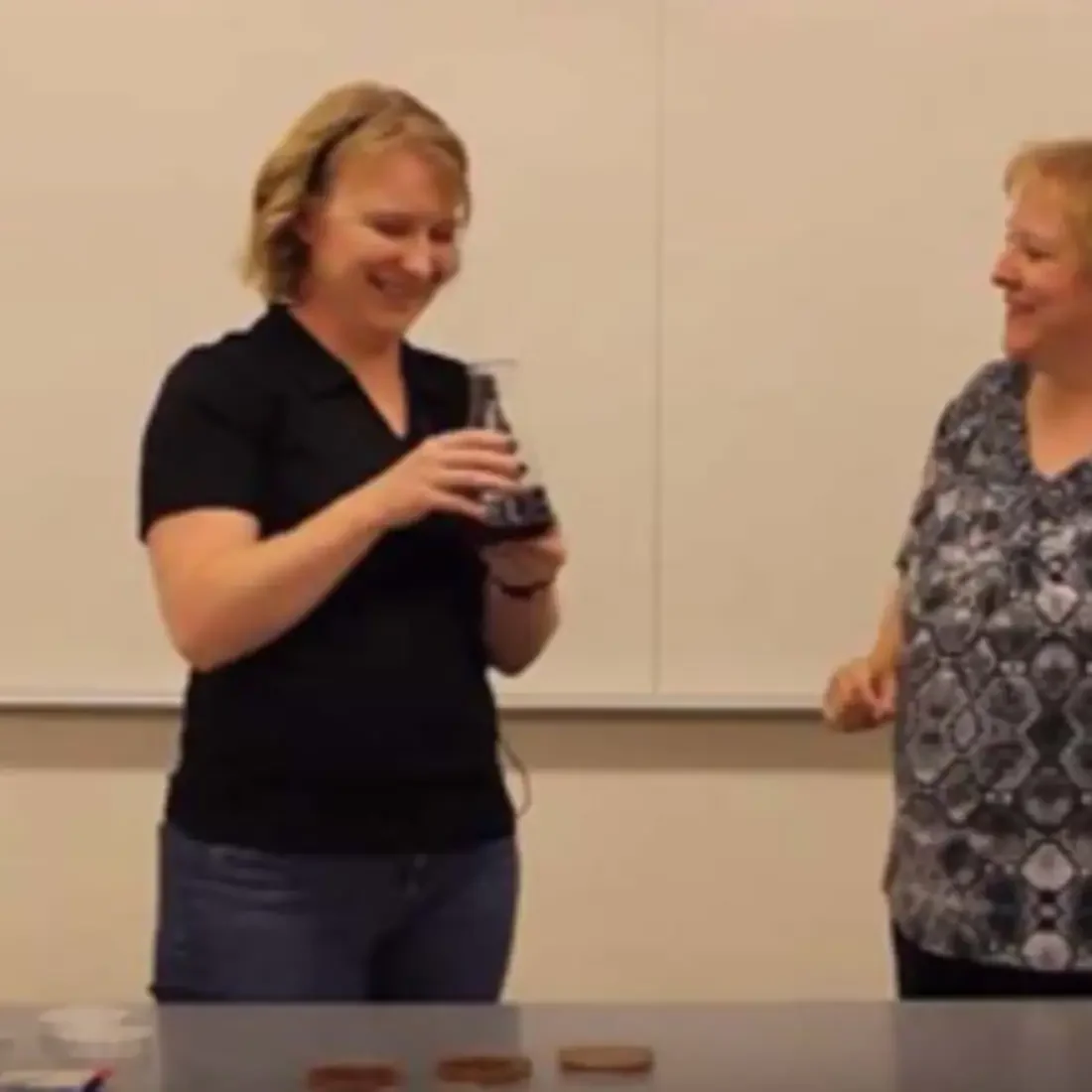 Two faculty members making agar