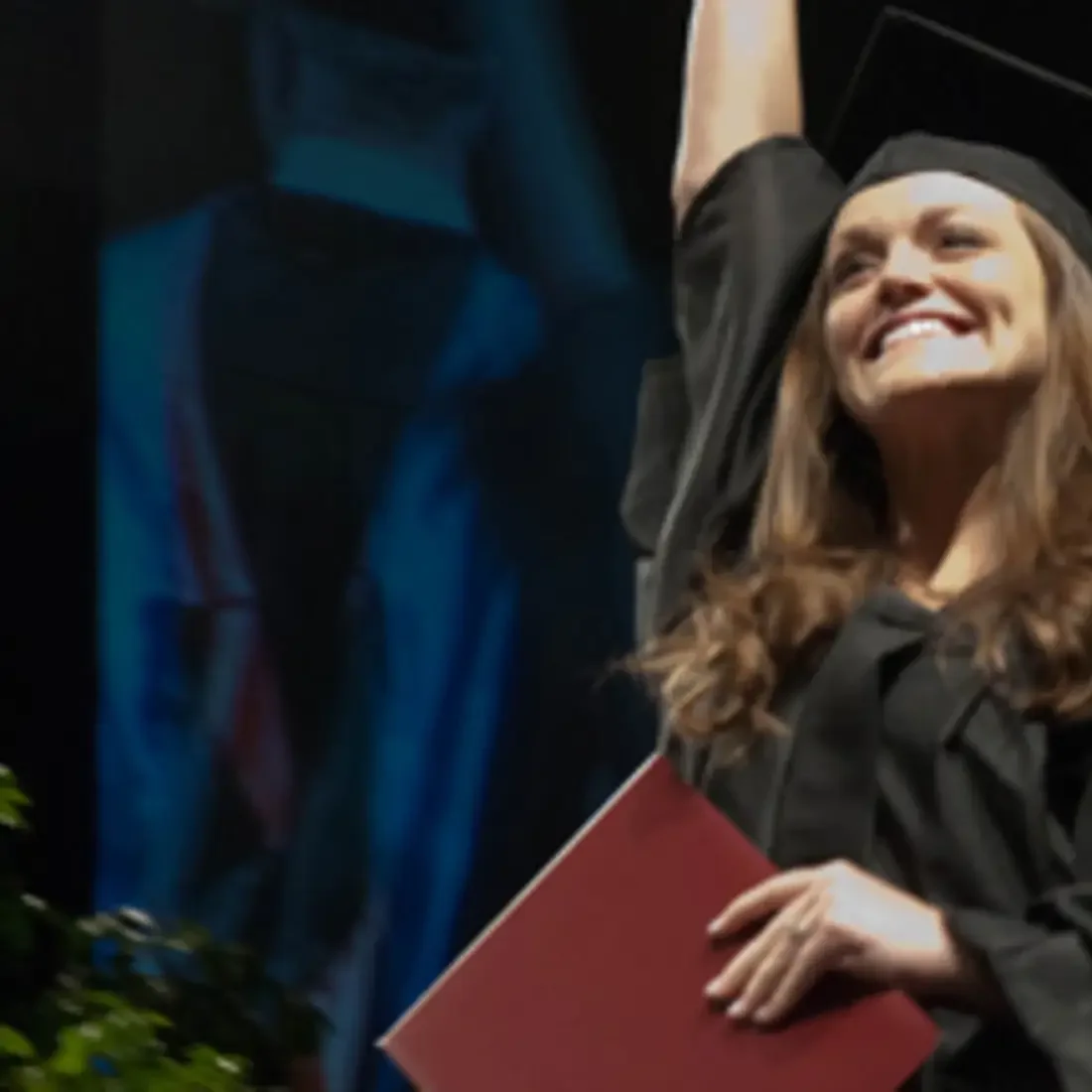 Student on stage at commencement