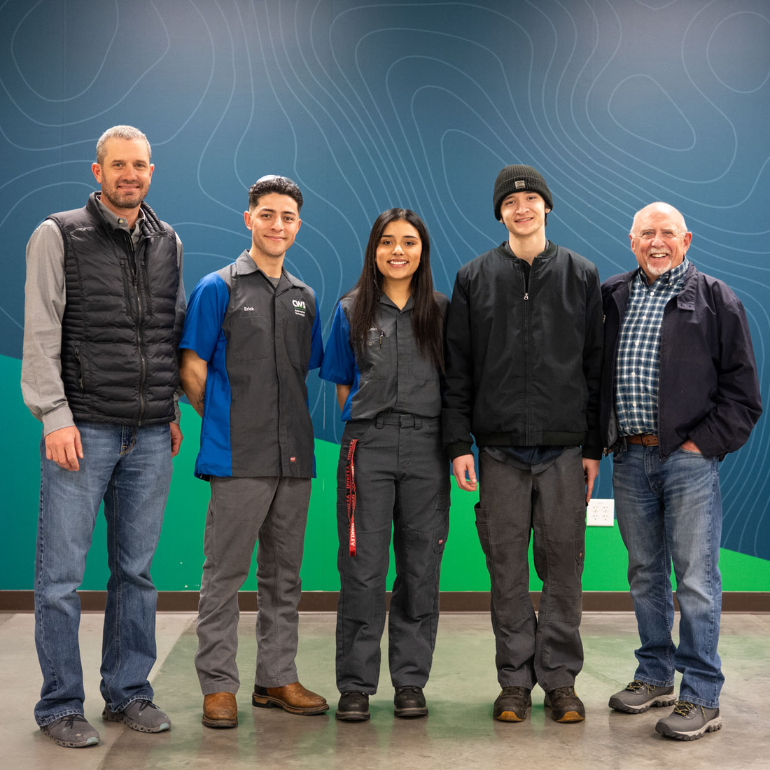 Students stand with donors for a photo.