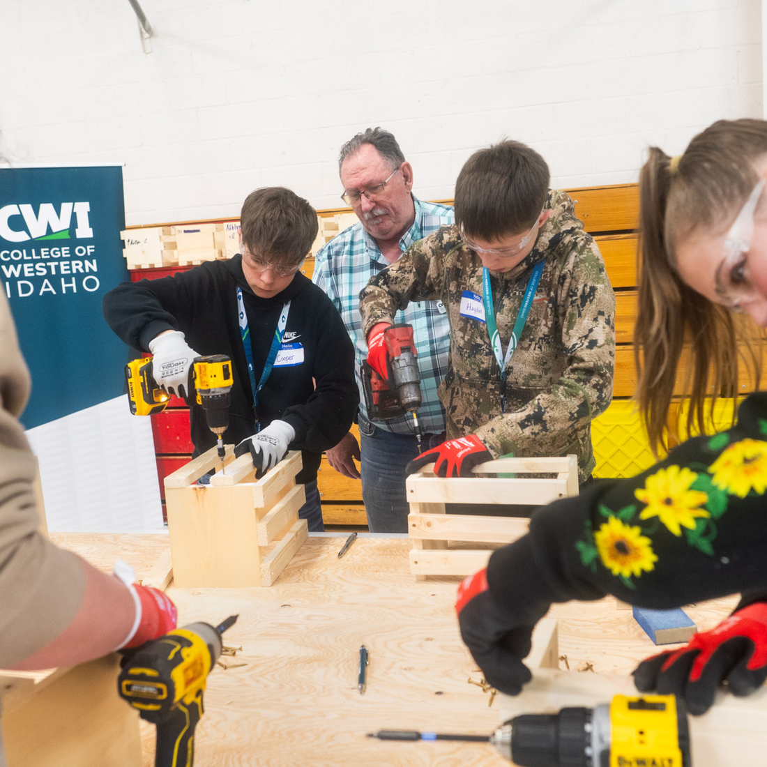 Students learn about trade skills from an instructor.
