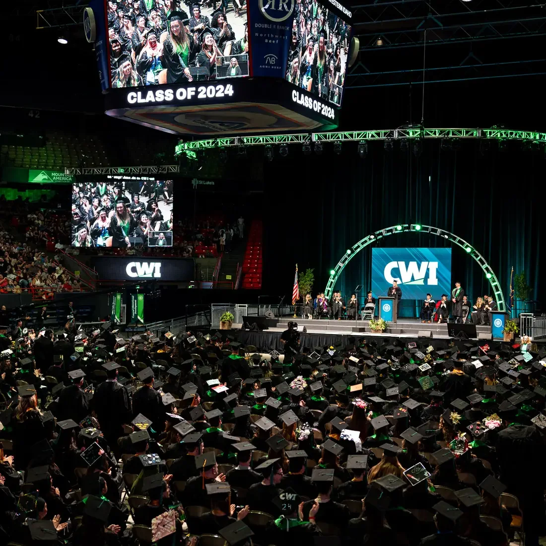 Graduates attend a commencement ceremony.