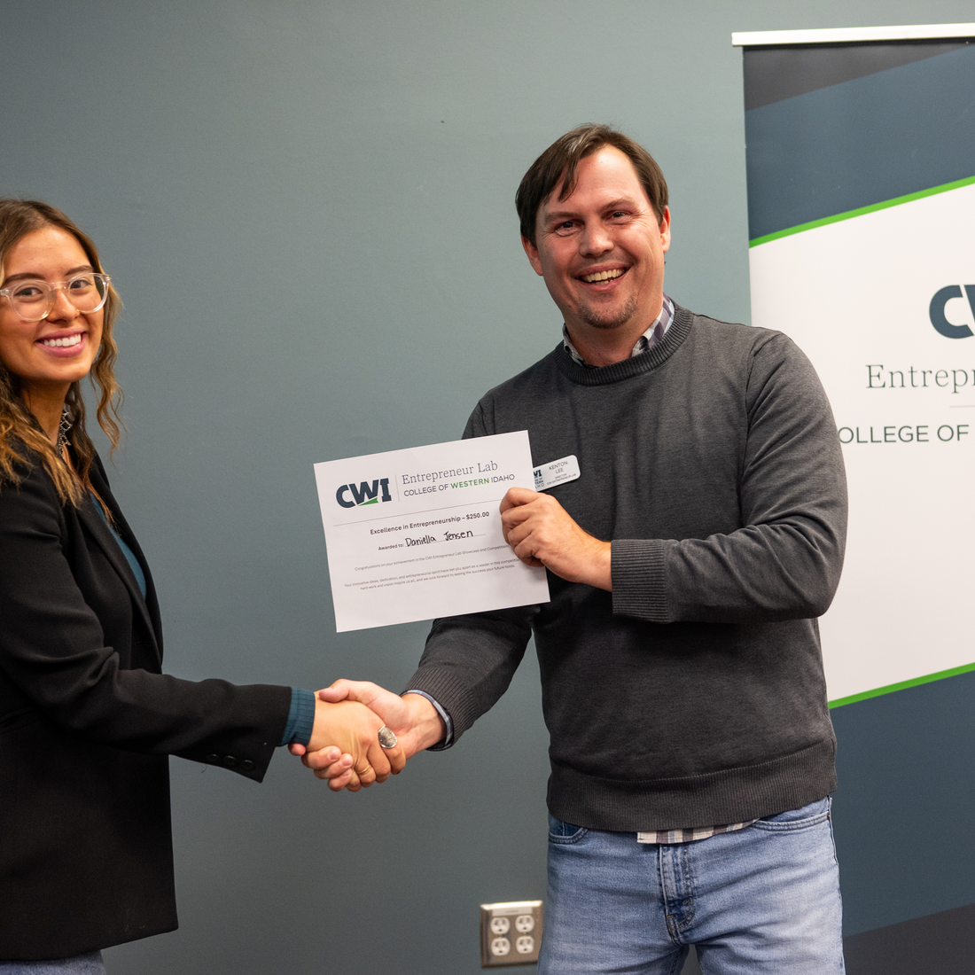 Daniella Jenson receiving award from Kenton Lee at a CWI Entrepreneur event