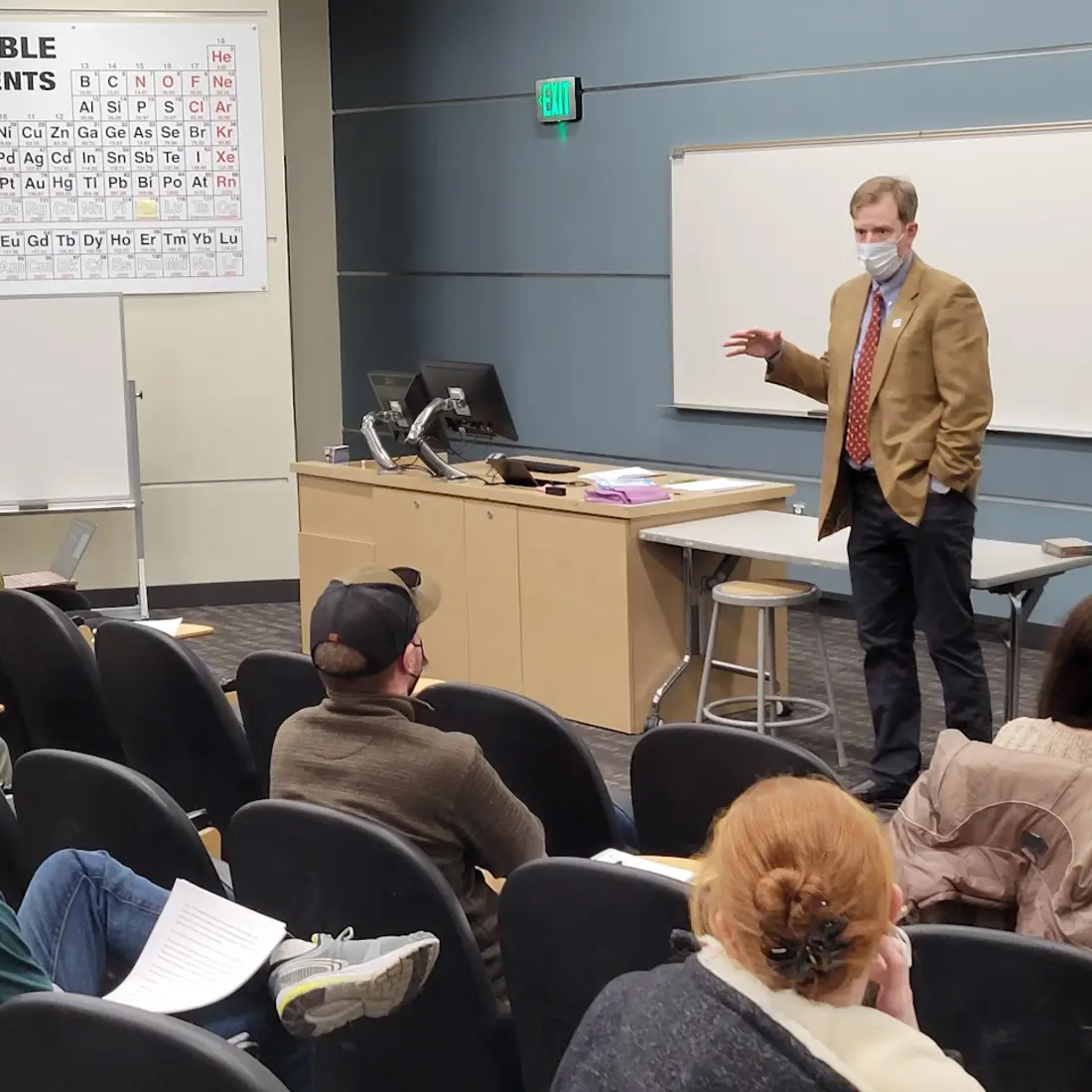 President Jones speaking to a group of students in a classroom