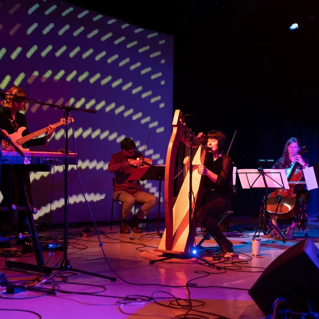 WEND performing on a stage