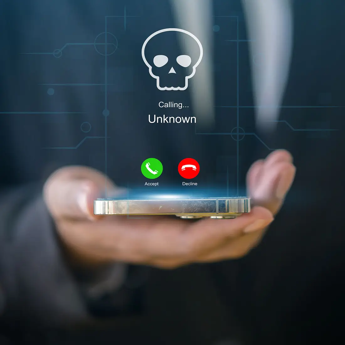 A photo of a hand holding a cellphone with a graphic of a skull, indicating a cyberscam.