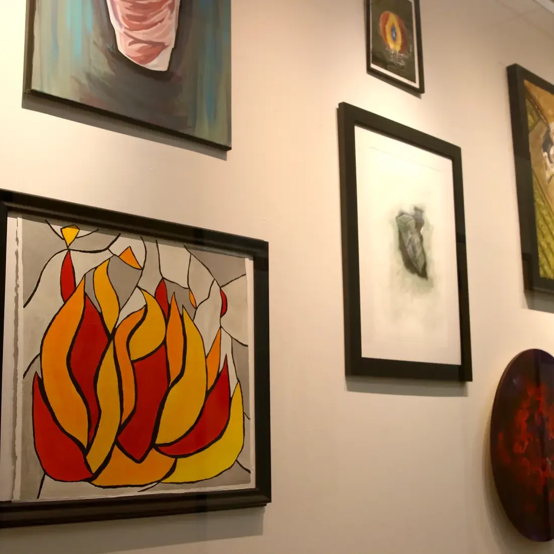 Paintings displayed in the Art Studio Gallery located at the Nampa Campus Academic Building