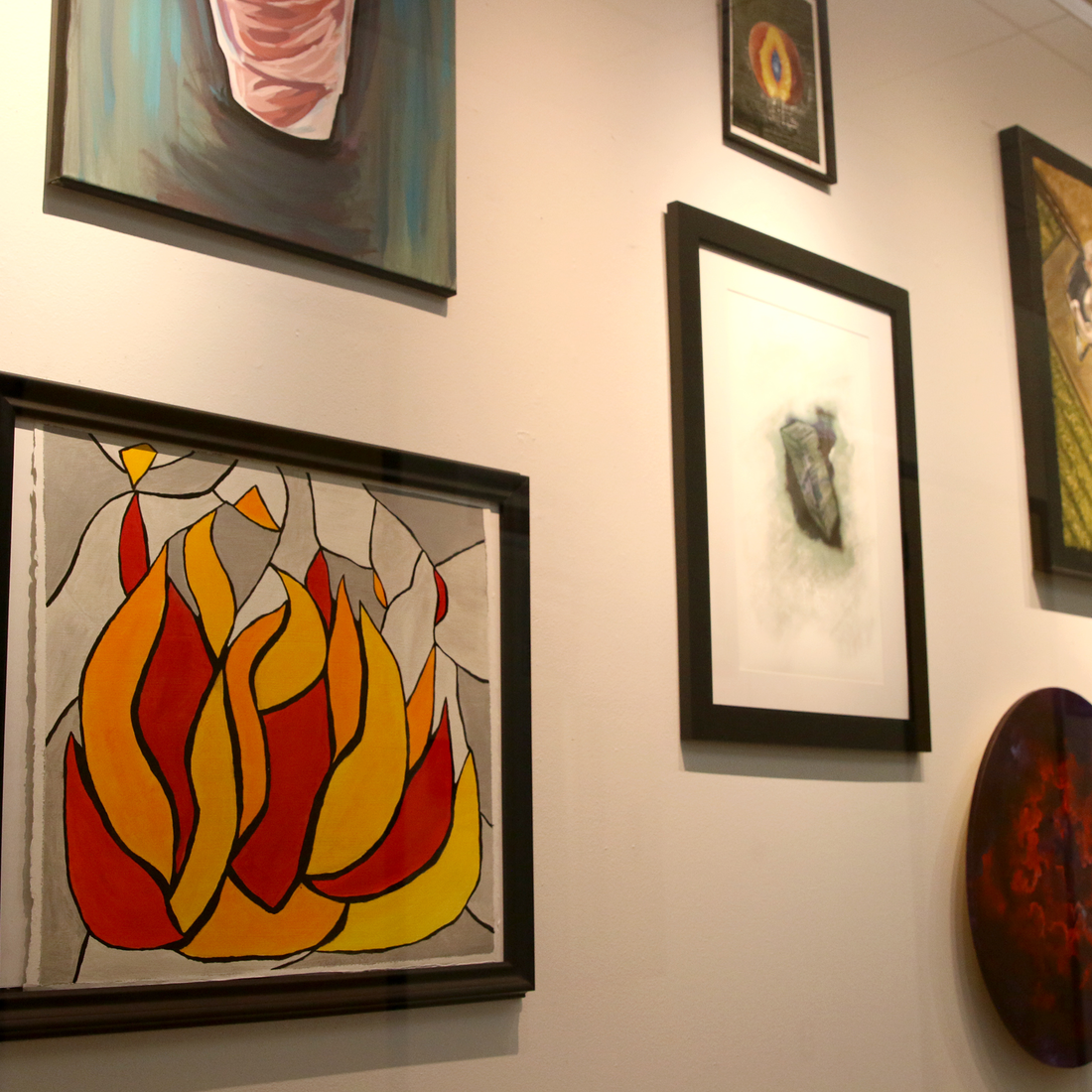 Paintings displayed in the Art Studio Gallery located at the Nampa Campus Academic Building