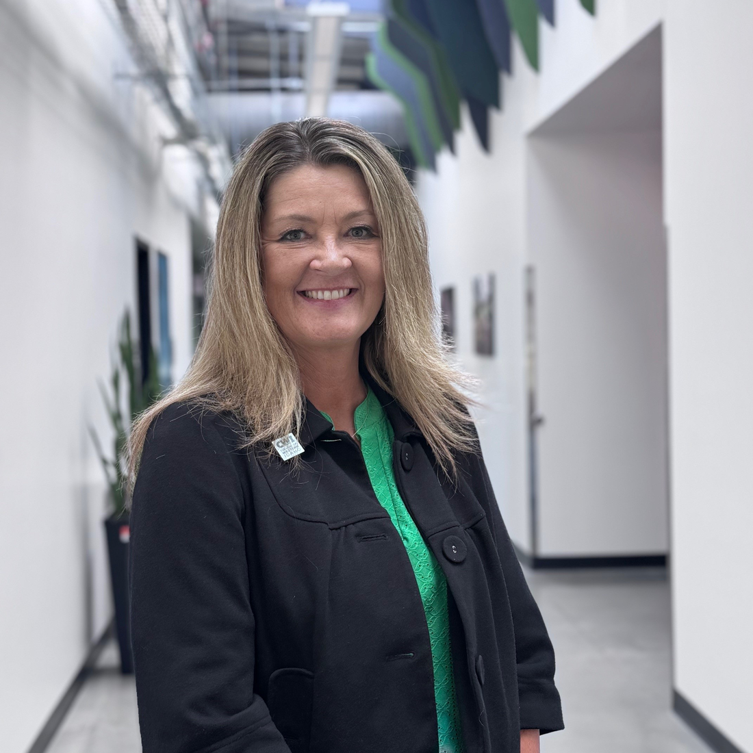 Audrey Eldridge standing in hallway 