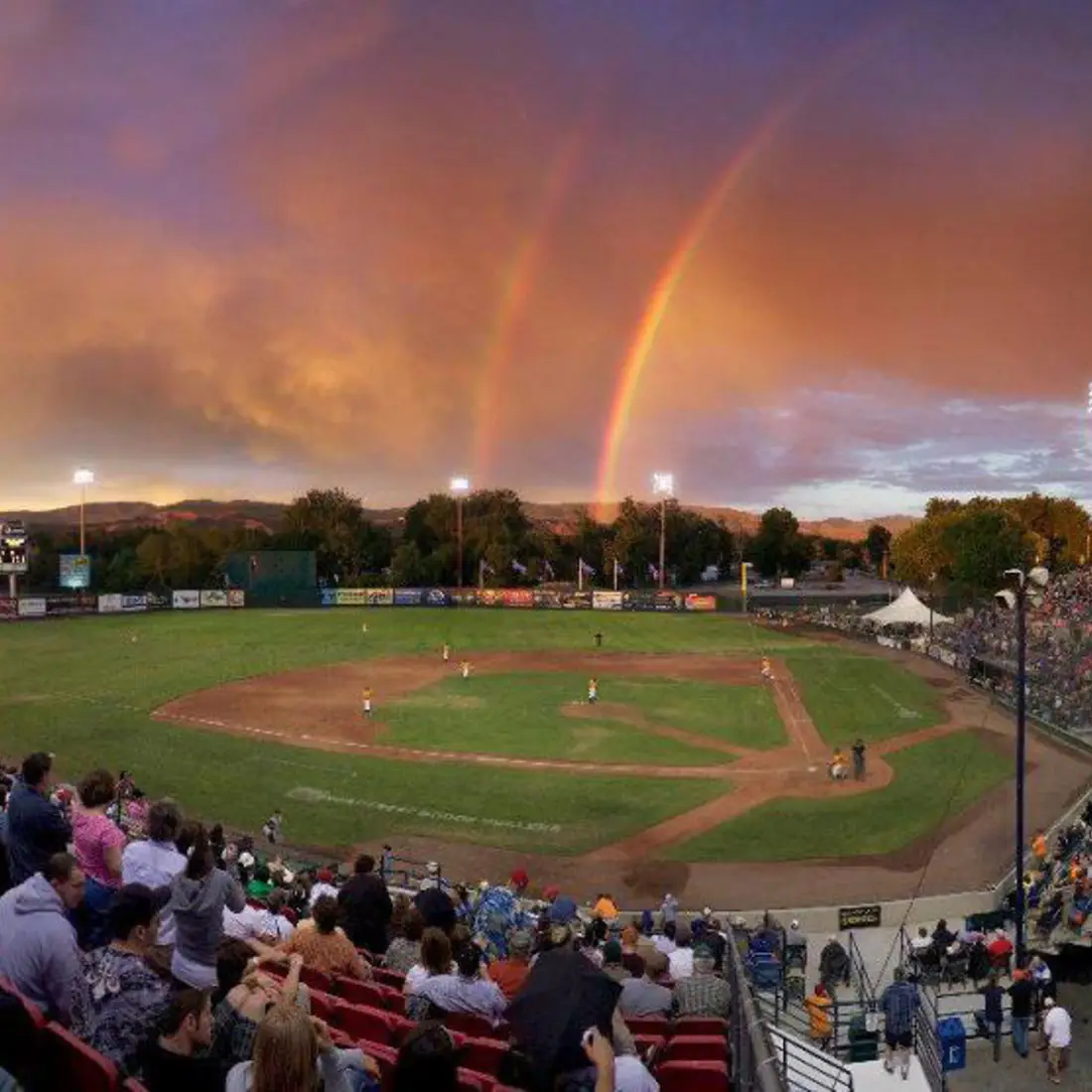 Boise Hawks baseball field with a double rainbow in the sky