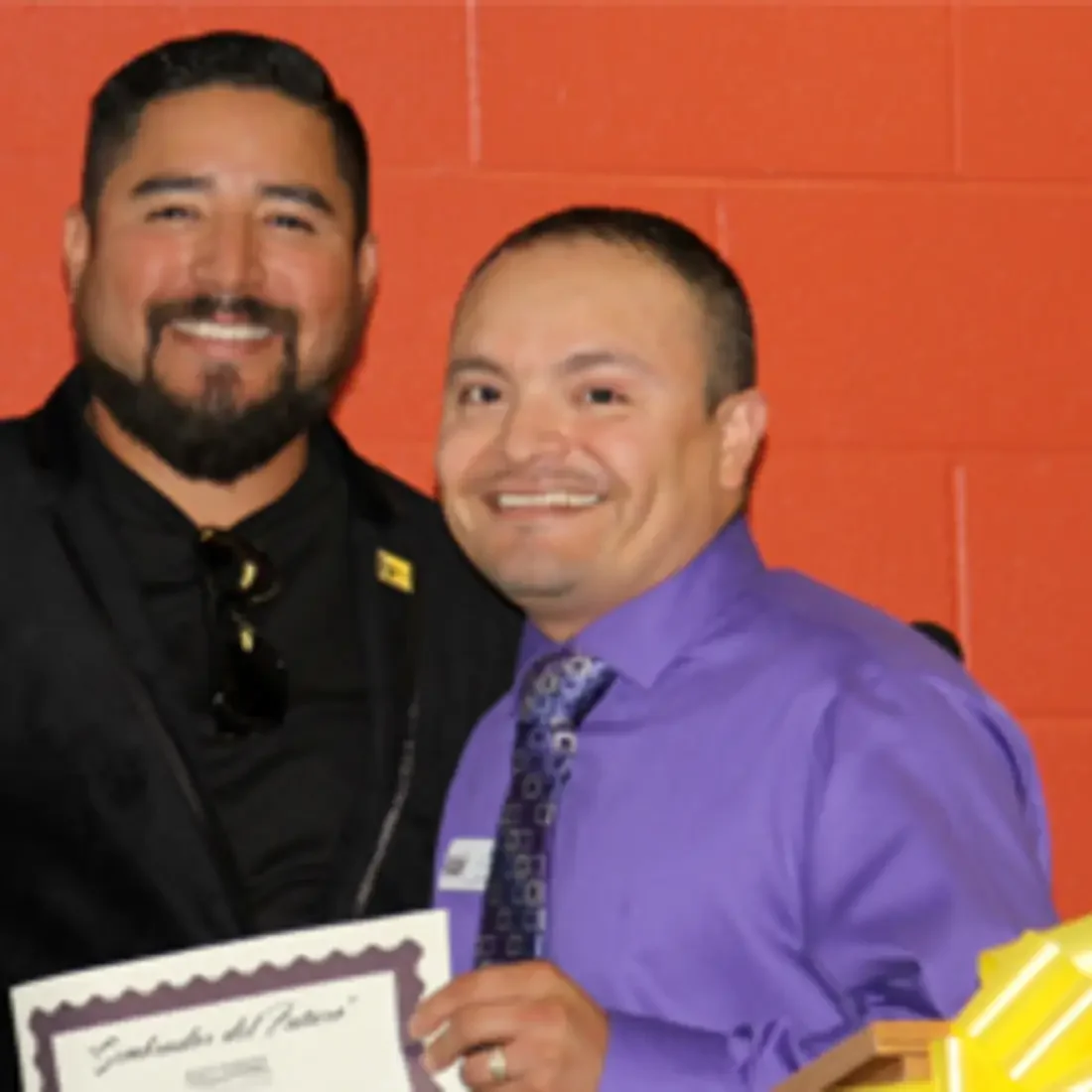 Luis Caloca with recognition certificate