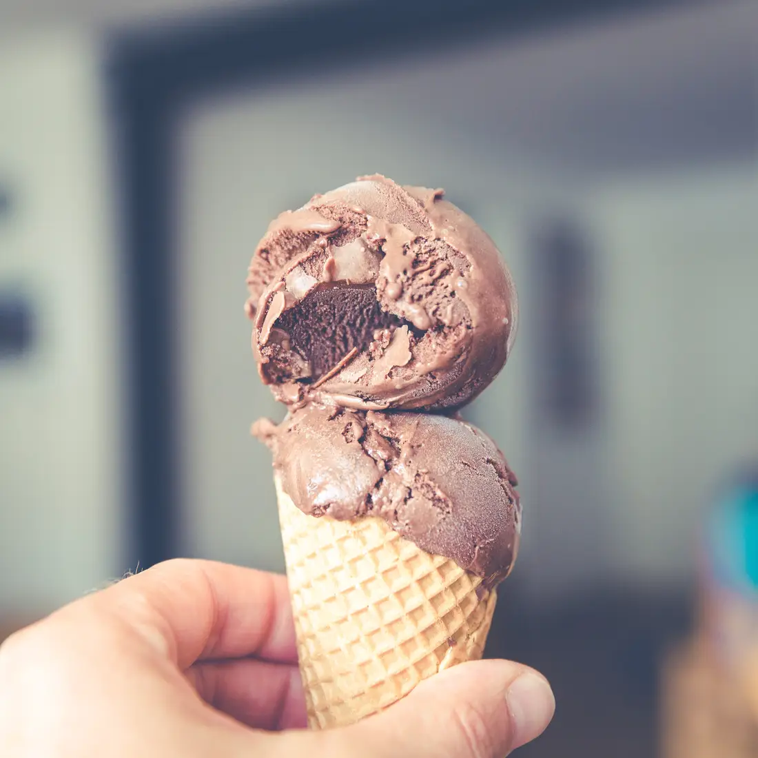 Hand holding ice cream cone