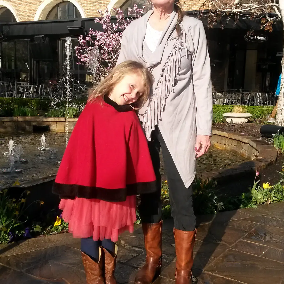 Deb standing outside in front of brick building