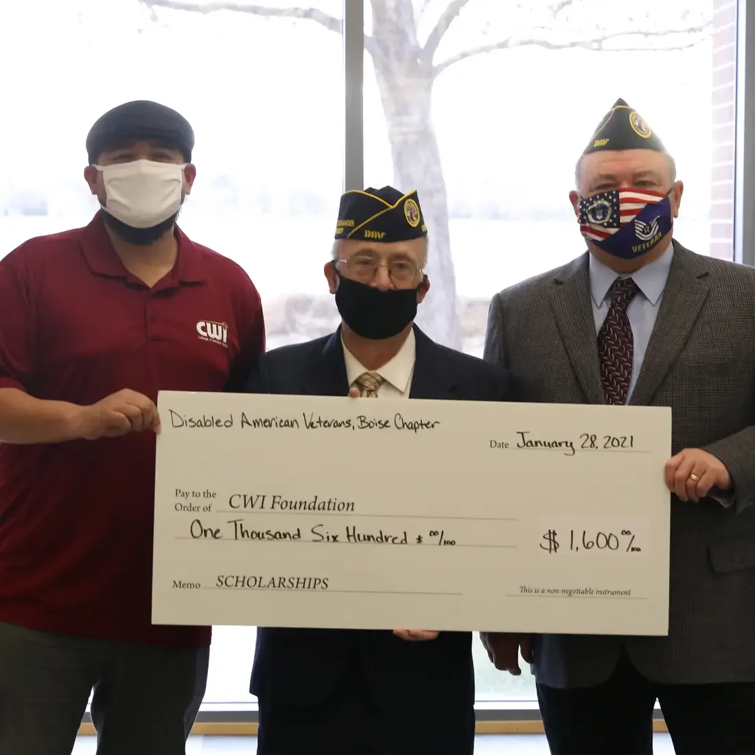 Ivan Castillo accepting a donation to the CWI Foundation from the Disabled American Veterans Chapter 2 Boise