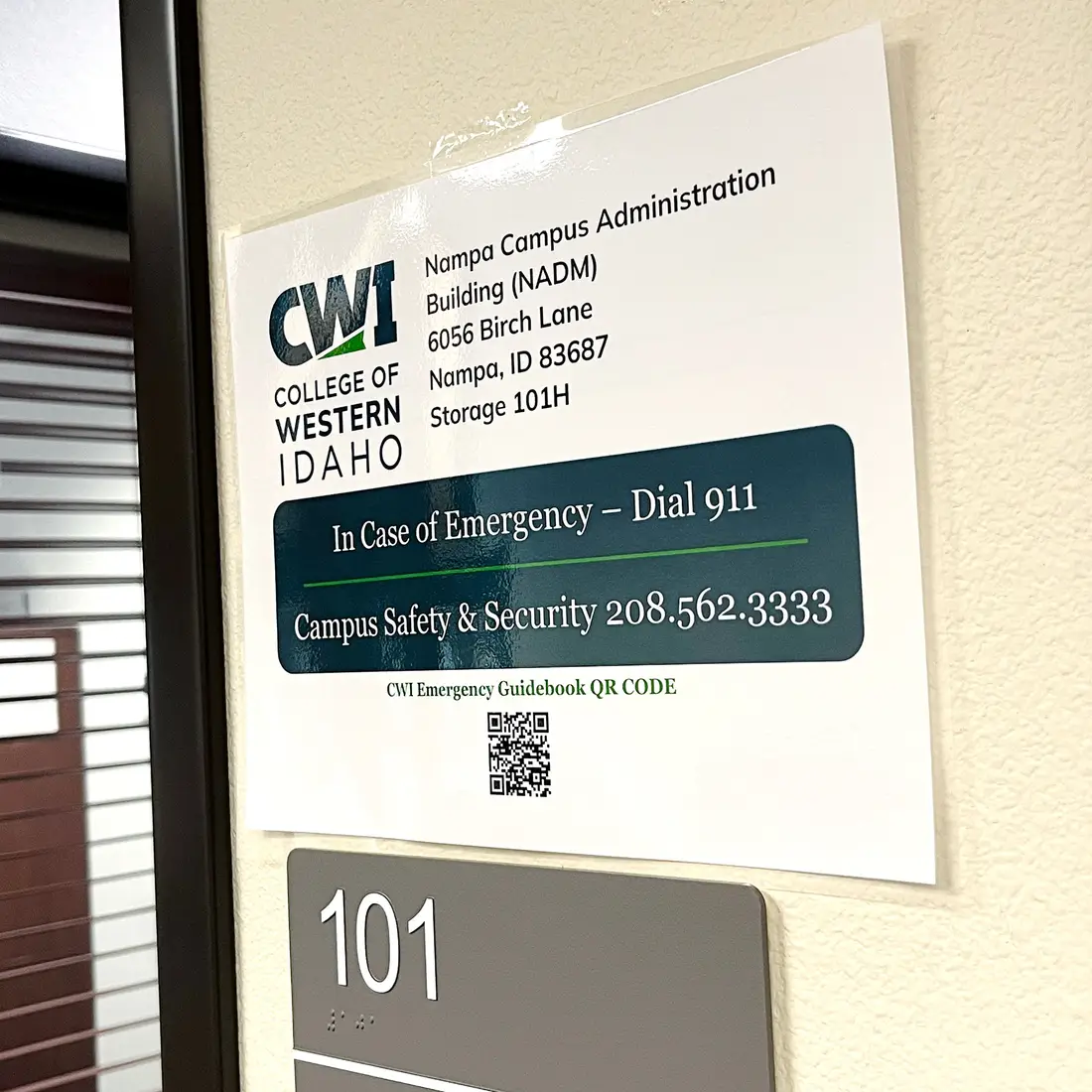 An image showing a posted sign detailing emergency contact and security information.