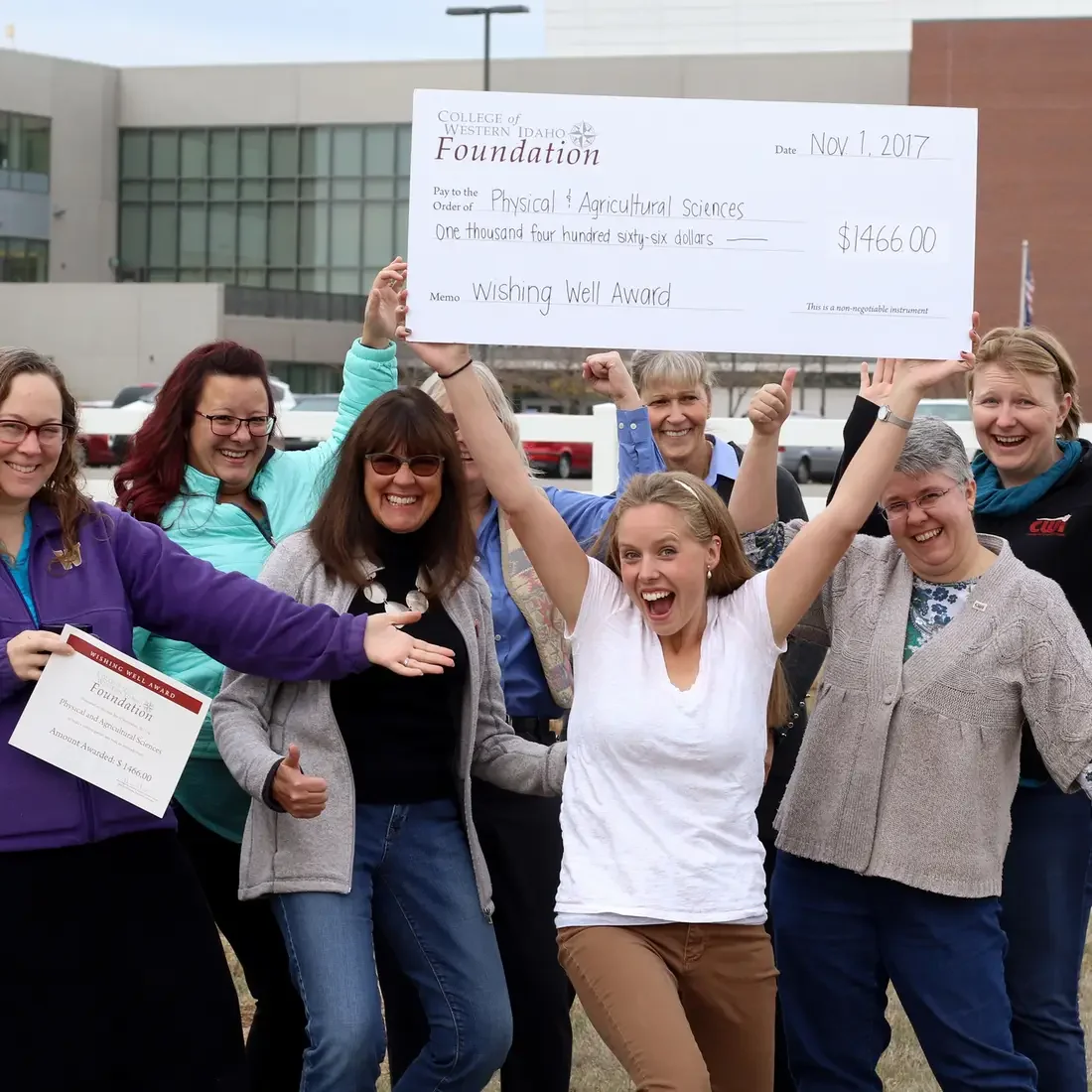 Wishing Well Fund recipients group shot with giant check