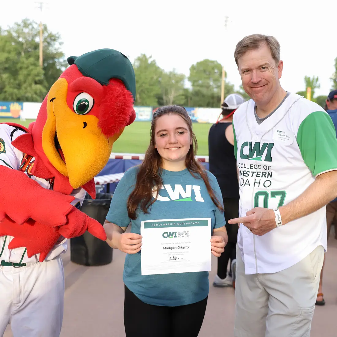 Humphrey the Hawks with SCORE Big Scholarship recipient, Madigan Grigsby, and President Gordon Jones