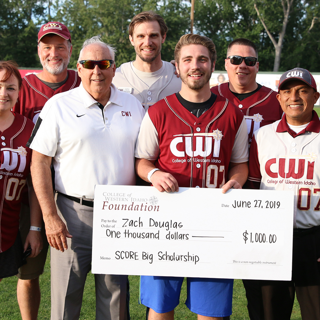 Zach Douglas receives a SCORE Big Scholarship at CWI Night at the Boise Hawks