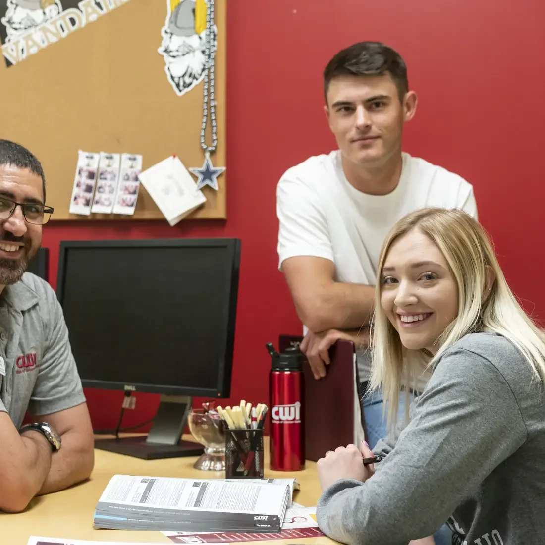 One Stop Representative talking to two students