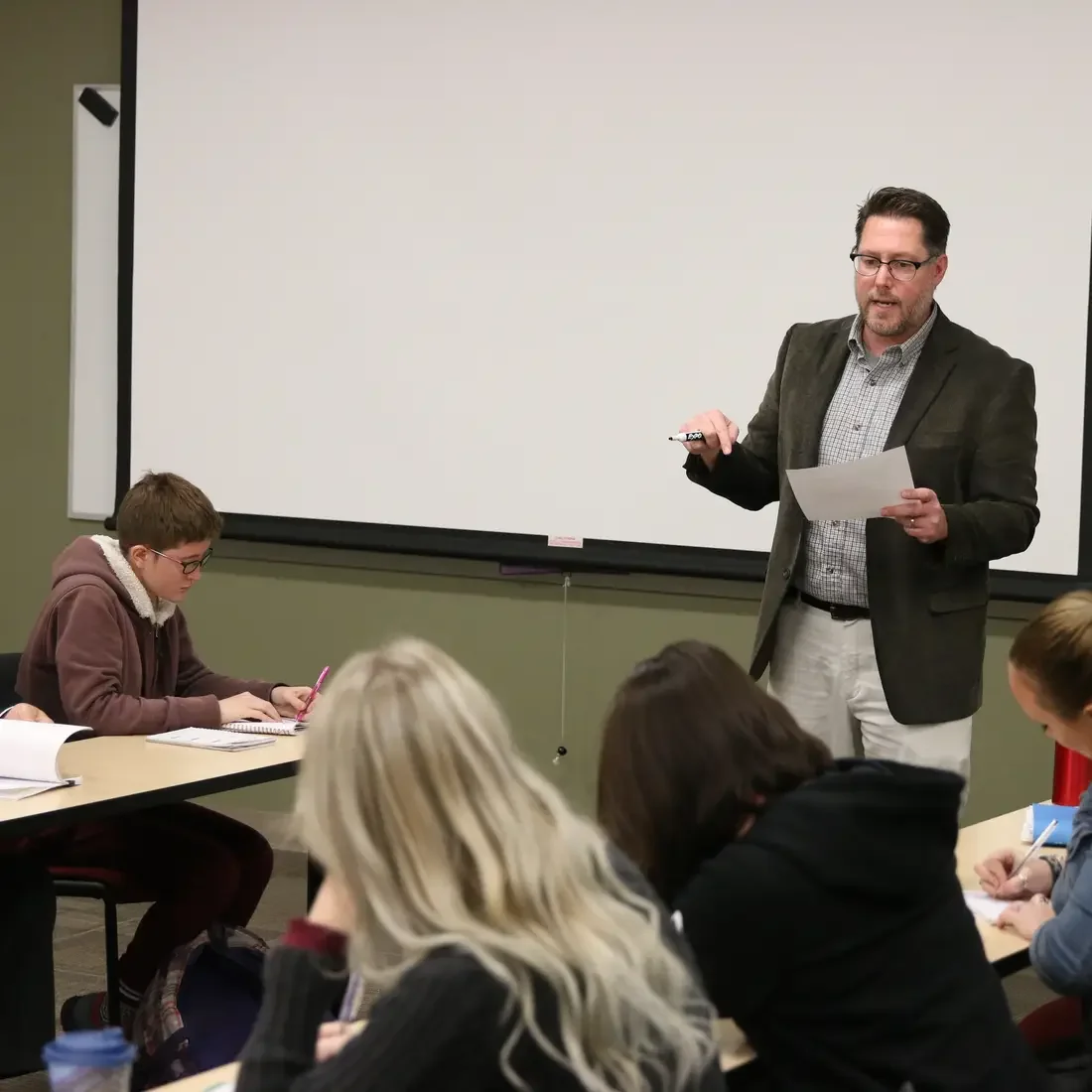 Ryan Witt teaching in front of a class
