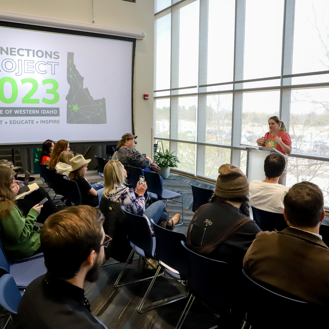 Student giving a live mini-talk at Connections Project