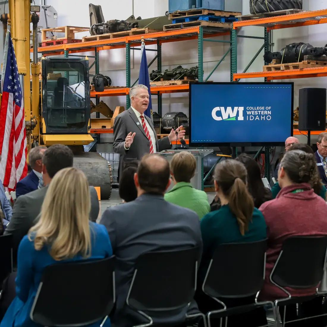 Governor Little speaking in front of audience at CWI