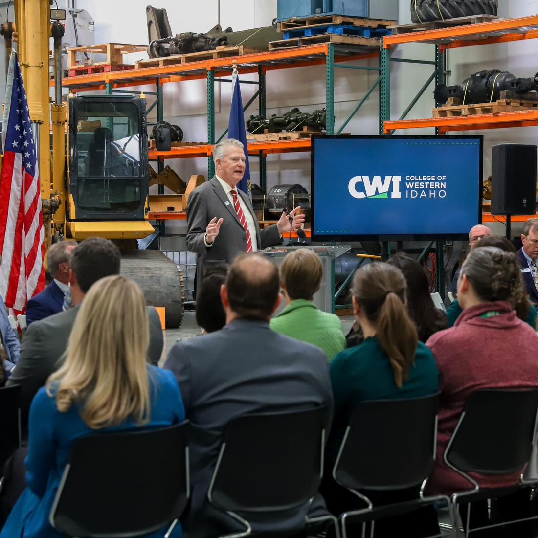 Governor Little speaking in front of audience at CWI