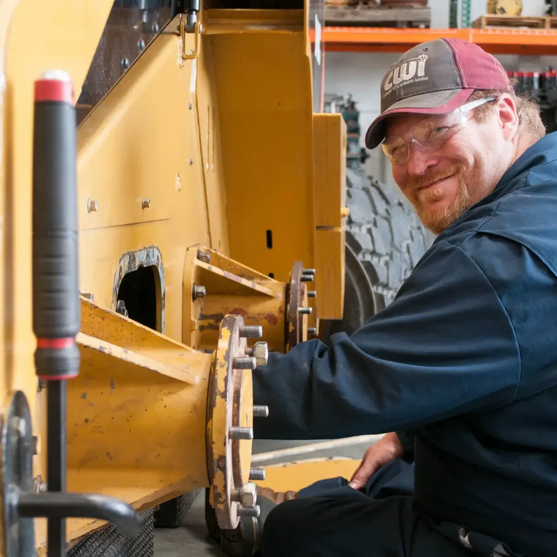 CWI Heavy Equipment student working on a skid steer