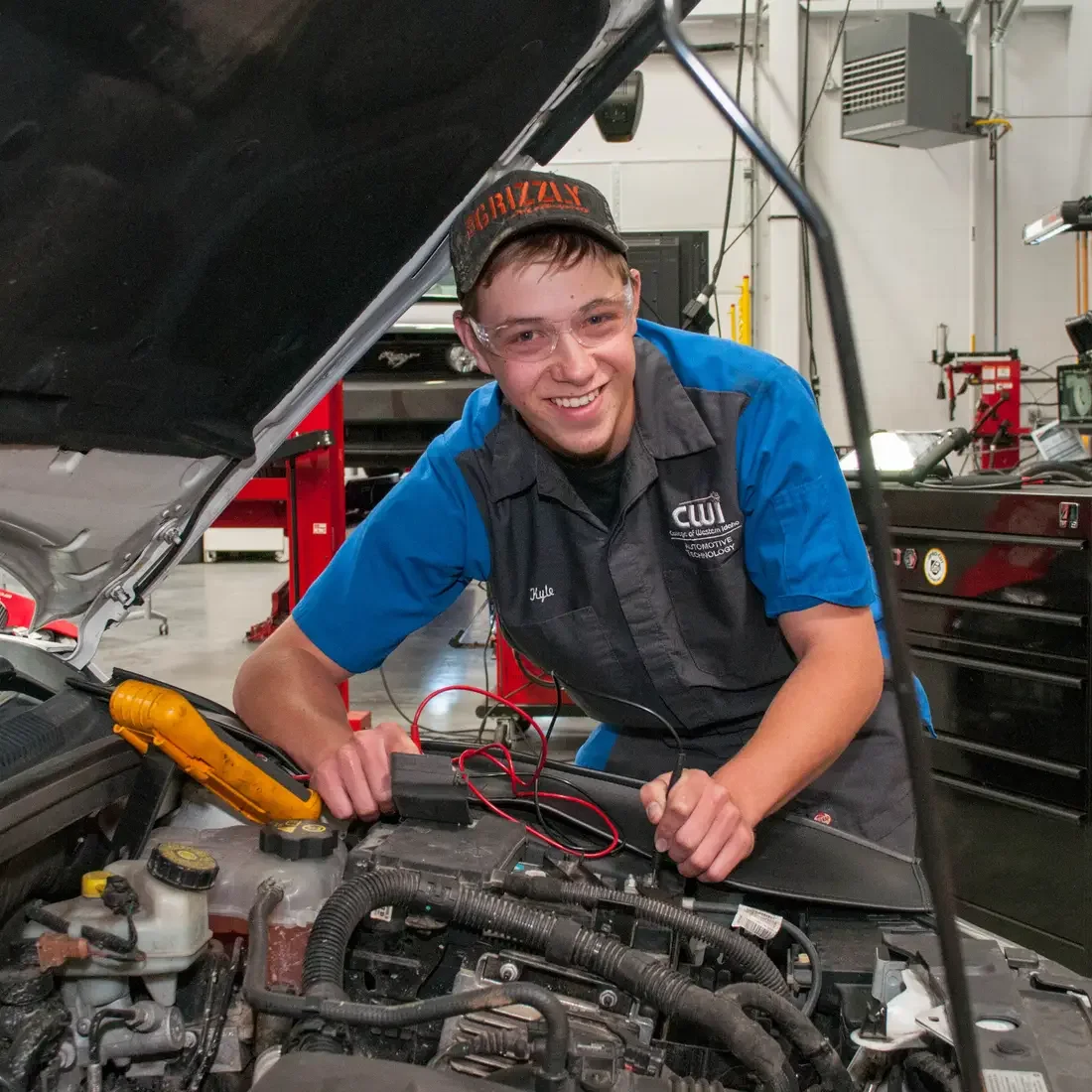 CWI Automotive Technology student working on a car in the lab