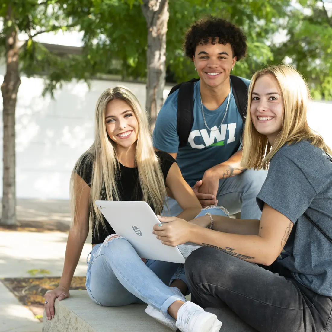 Students working on computer outside CWI