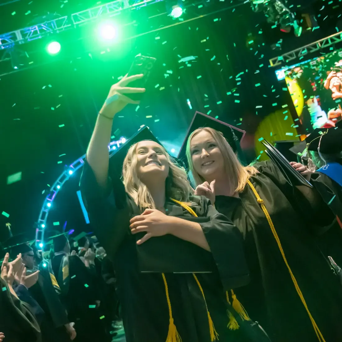 Students taking selfie at graduation