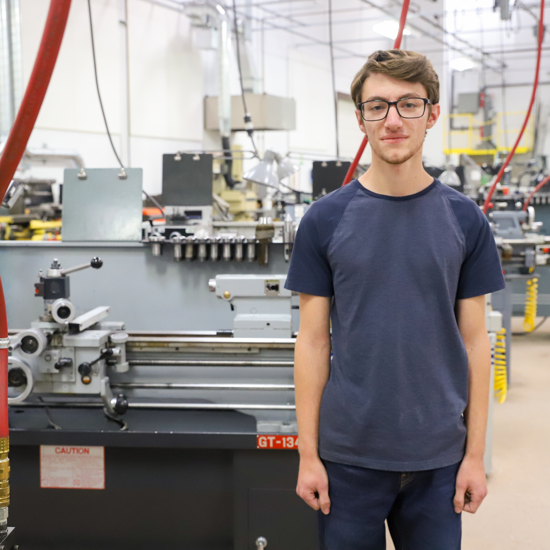 Wade Kindberg stands in his Mechatronics classroom
