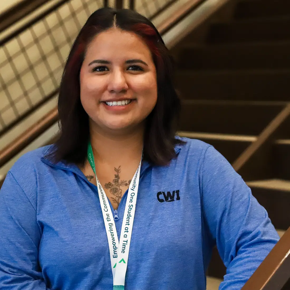 Maria Zavala standing on NMEC staircase