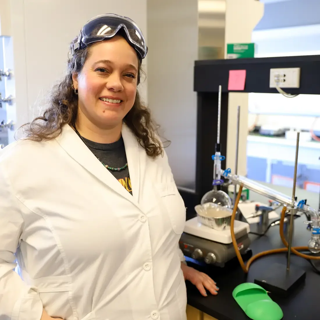 Rebecca Flock posing for a picture in front of lab