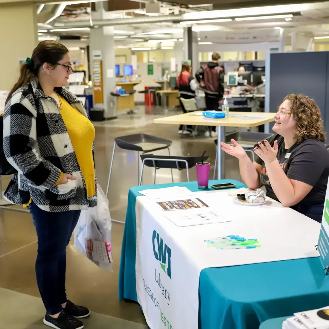 Student talking to librarian