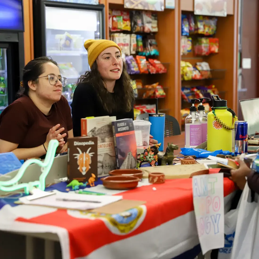 Students sit at a club booth