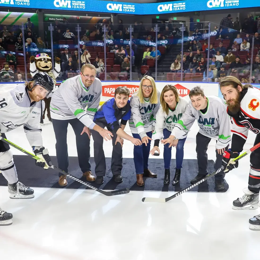Puck drop with Trustees and students