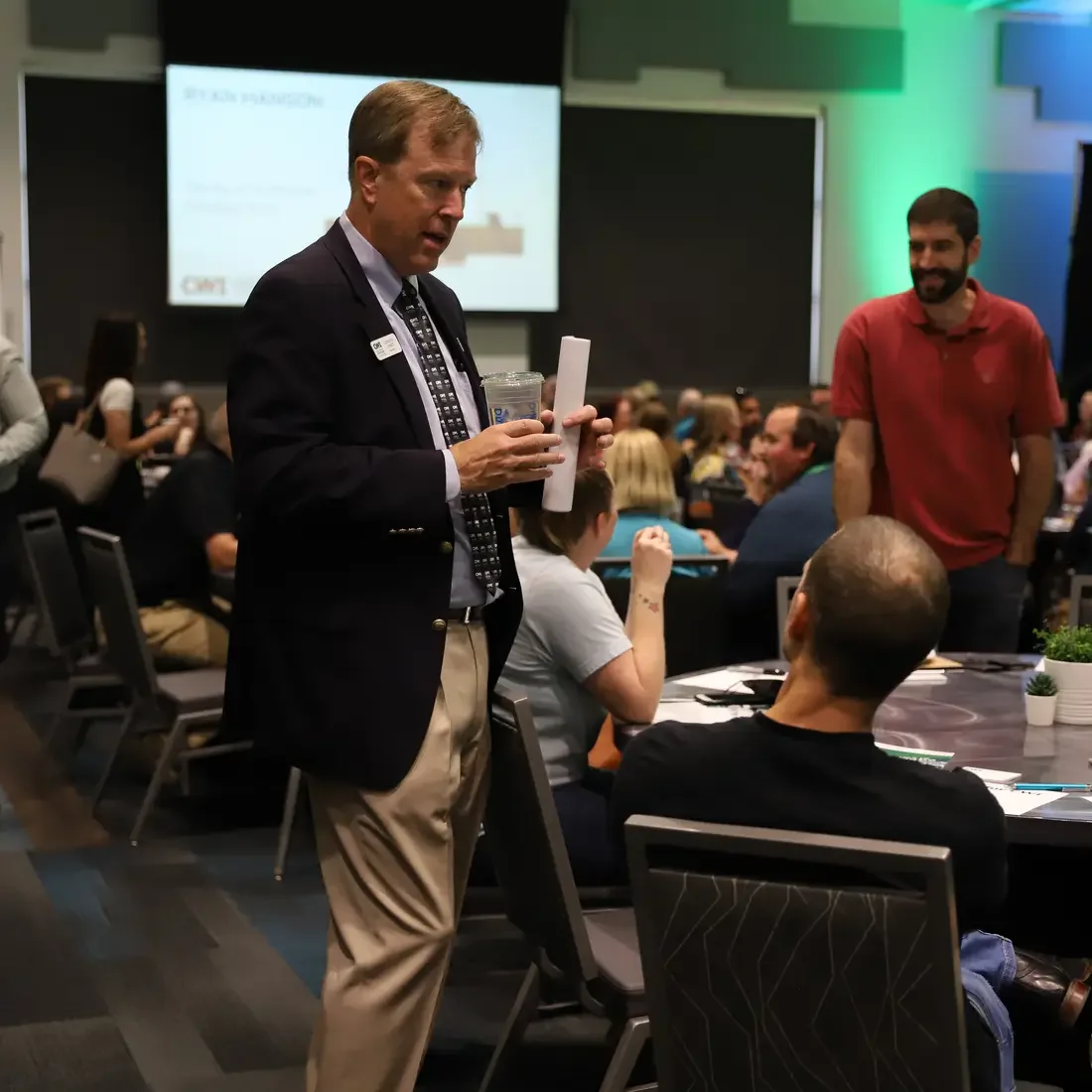 President Gordon Jones chatting with CWI employee