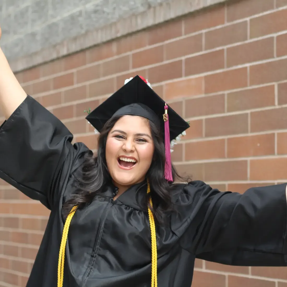 Graduate in a cap and gown