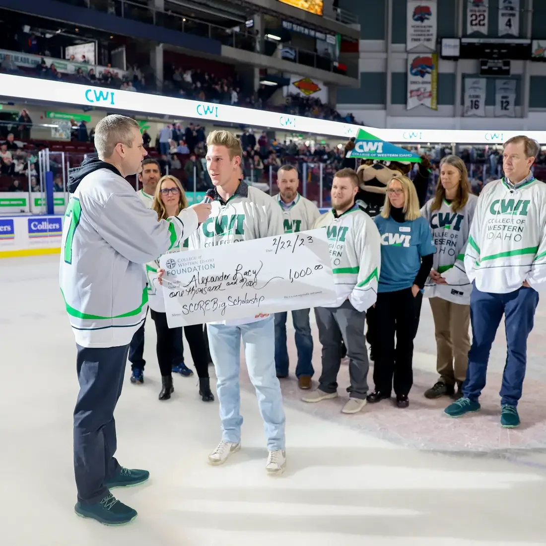 Alexander Lacy recieving his scholarship at Idaho Steelheads game